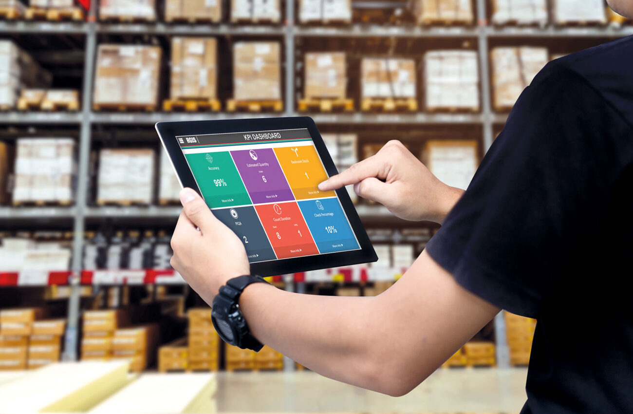 Smart warehouse management system.Worker hands holding tablet on